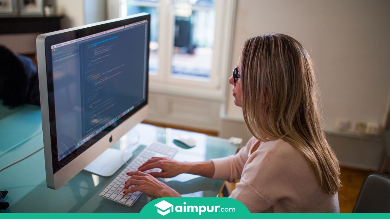 A girl with her computer - How to Become a Software Engineer After 12th - Aimpur